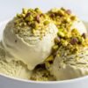 creamy pistachio ice cream scoop in bowl