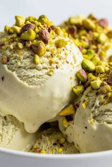 creamy pistachio ice cream scoop in bowl