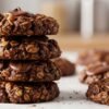 4 ingredient chocolate peanut butter no bake cookies stacked with oats and chocolate