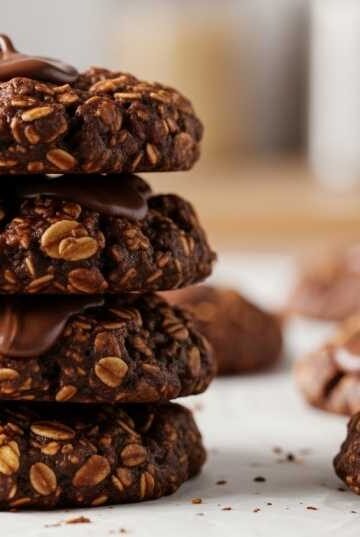 4 ingredient chocolate peanut butter no bake cookies stacked with oats and chocolate