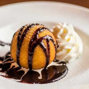 Japanese fried ice cream served with chocolate sauce and whipped cream
