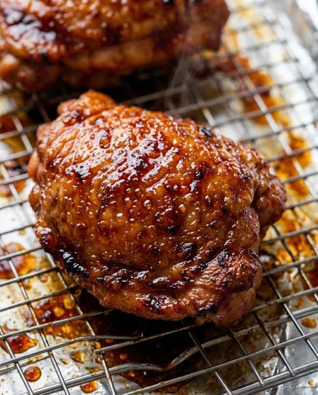 Char siu chicken thighs with bubbling caramelized sticky glaze and slight char edges fresh from the broiler